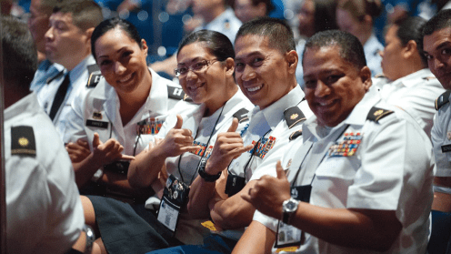 HANGIN’ IN CHICAGO Members of the Hawaii delegation share a little island spirit during a conference business session. (page 22)