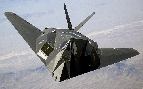 A U.S. Air Force F-117A 'Nighthawk' Stealth Fighter aircraft flies over Nellis Air Force Base, Nev., during the joint service experimentation process dubbed Millennium Challenge 2002. Sponsored by the US Joint Forces Command, the Millenniun Challenge 2002 experiment explores how Effects Based Operations can provide an integrated joint context for conducting rapid, decisive operations. (U.S. Air Force photo by Staff Sgt. Aaron Allmon II) (Released)