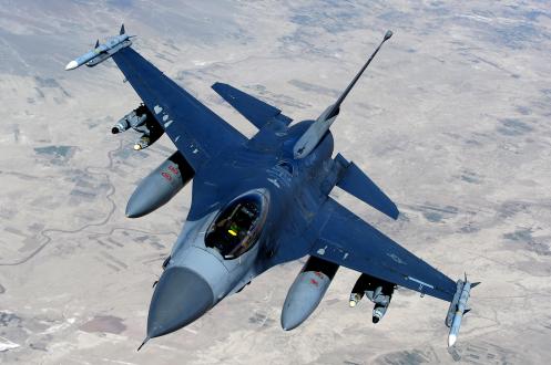 An F-16 Fighting Falcon, from the 555th Fighter Squadron also known as “Triple Nickel,” Aviano Air Base, Italy, moves away after receiving fuel from a KC-135 Stratotanker, assigned to the 340th Expeditionary Air Refueling Squadron, over Afghanistan in support of Operation Enduring Freedom, March 29.